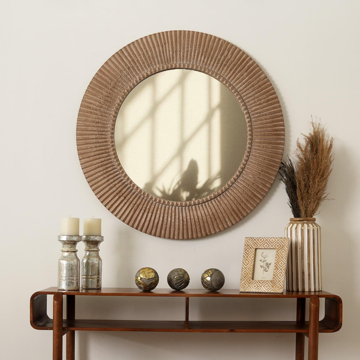 Hand-carved wall mirror in an antique brown and white finish