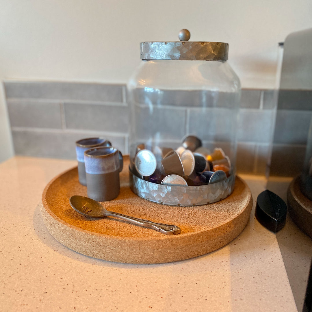 Round cork tray styled on a coffee table