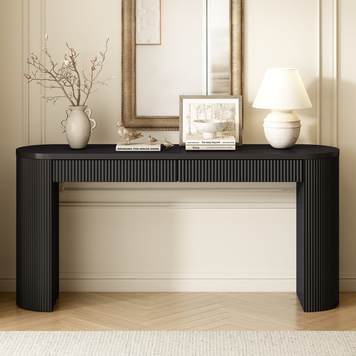 Black fluted console table with two drawers and arched legs