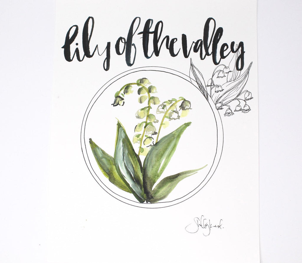 Lily of the valley print on a gallery wall