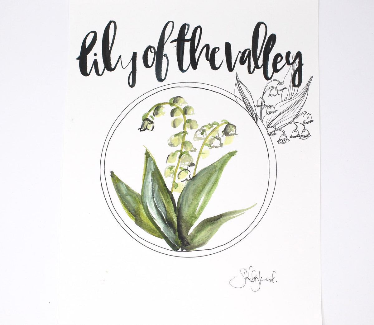 Lily of the valley print on a gallery wall